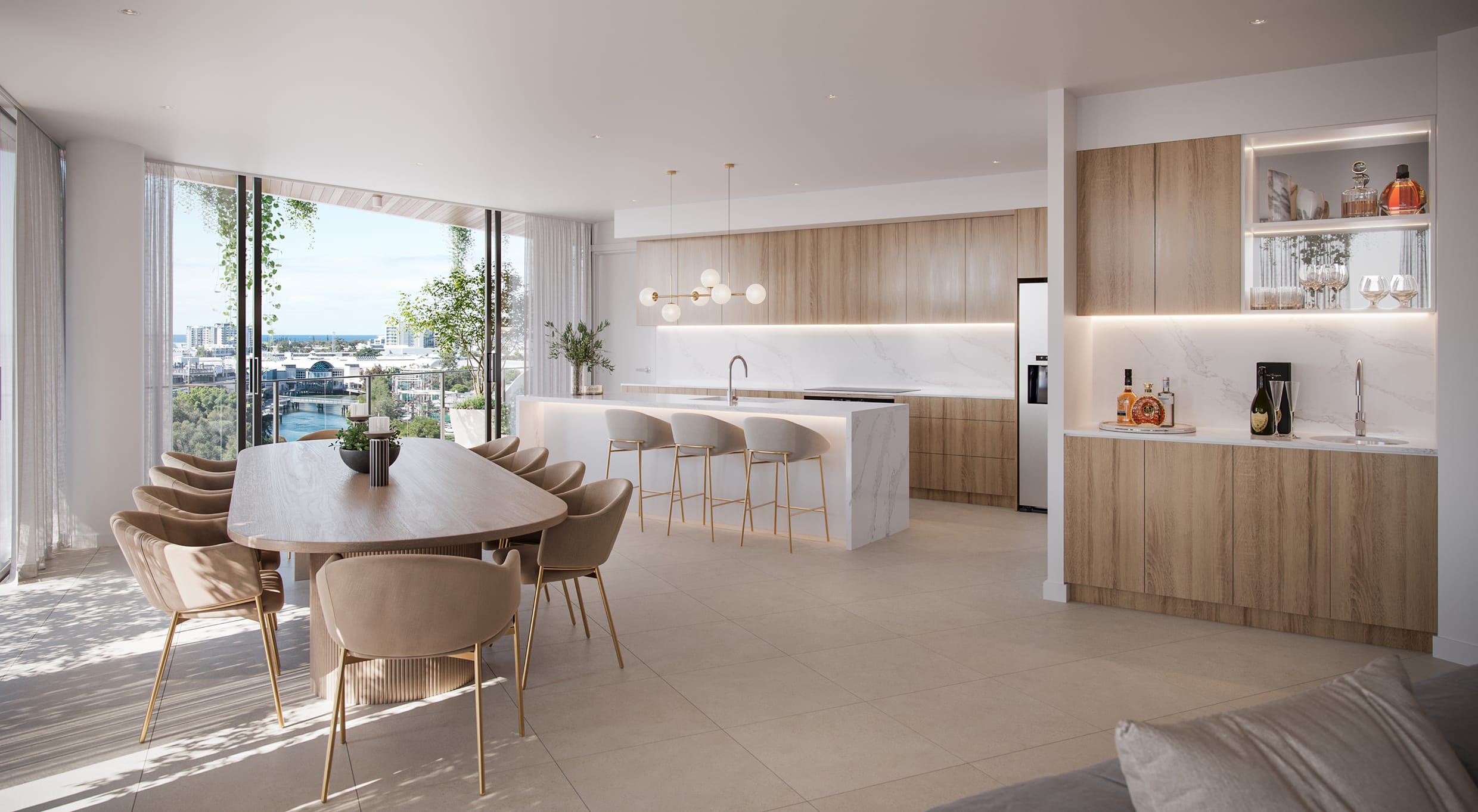 Penthouse kitchen and dining in The Millwell’s rooftop luxury apartments, Maroochydore—featuring a stone island bench, built-in bar, ocean views, and designer lighting.