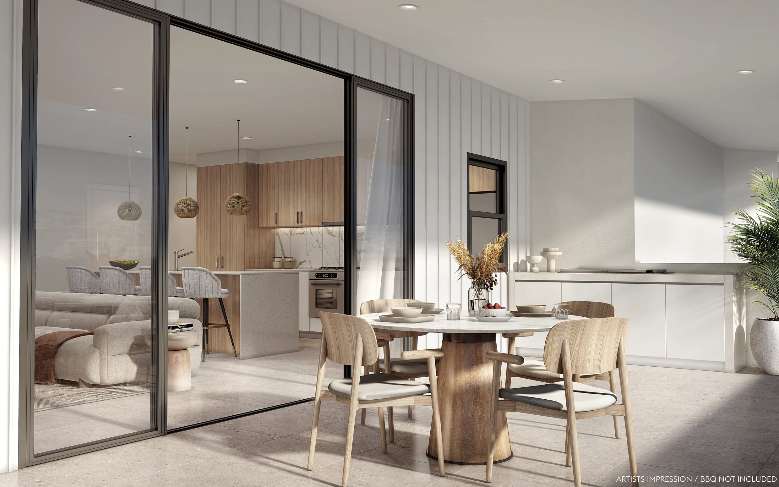 Peregian Springs apartment balcony featuring outdoor dining space and connection to modern open-plan interiors