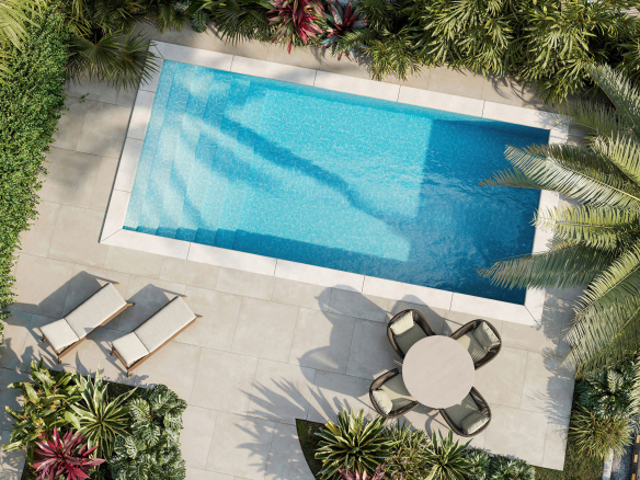 Aerial view of landscaped communal swimming pool and outdoor seating area at contemporary townhomes in Morayfield, Queensland