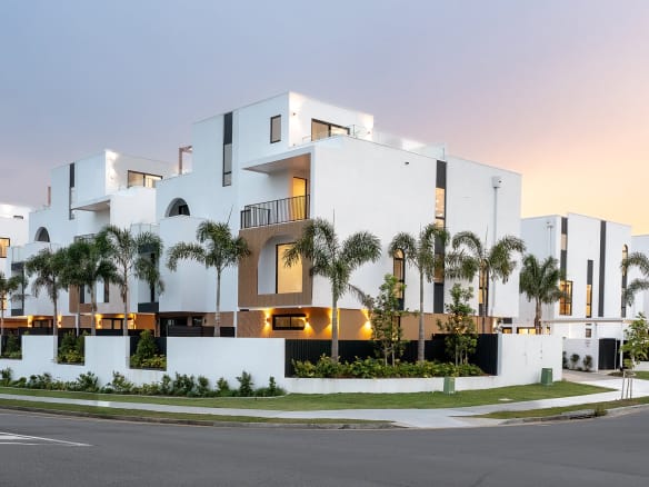 Luxury riverside townhomes in Bundall Gold Coast exterior view at sunset