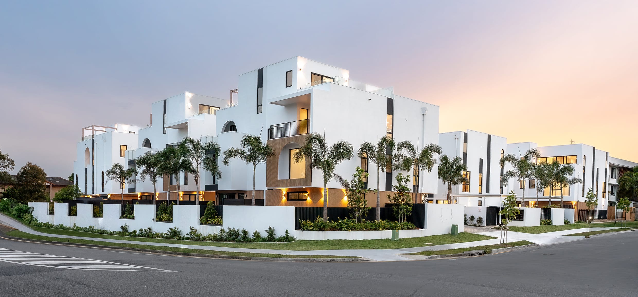 Luxury riverside townhomes in Bundall Gold Coast exterior view at sunset