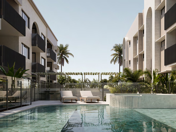 Landscaped residents’ swimming pool and sun lounges at new Stafford apartments in Brisbane.